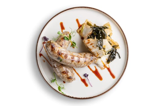 Fried Weisswurst (white veal sausage) with marinated cabbage and sea wed