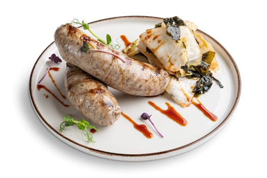 Fried Weisswurst (white veal sausage) with marinated cabbage and sea wed