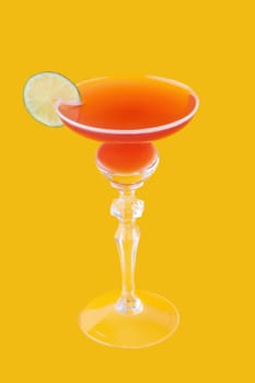 Cosmopolitan cocktail on yellow background