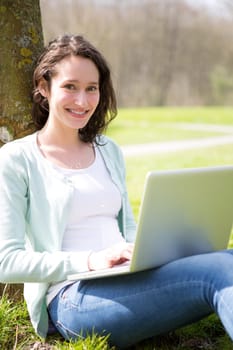 View of a Young attractive woman realxing at the park