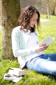 View of a Young attractive woman realxing at the park