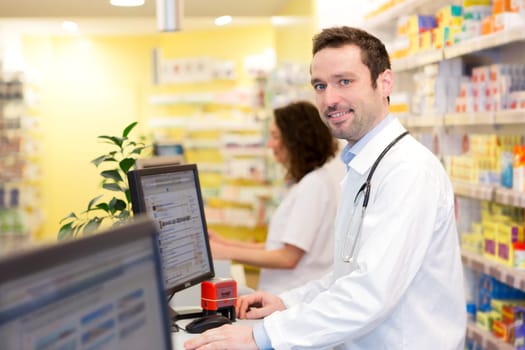 View of an attractive pharmacist team at work