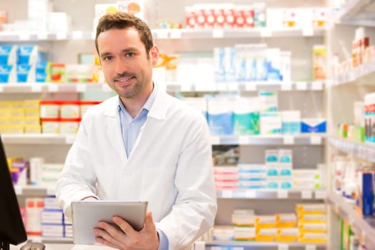 View of an attractive pharmacist at work