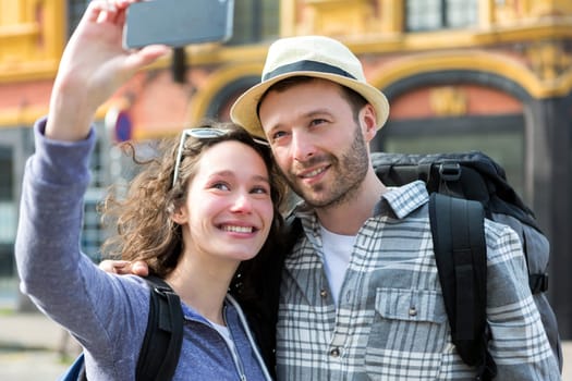 View of a Young couple on holidays taking selfie