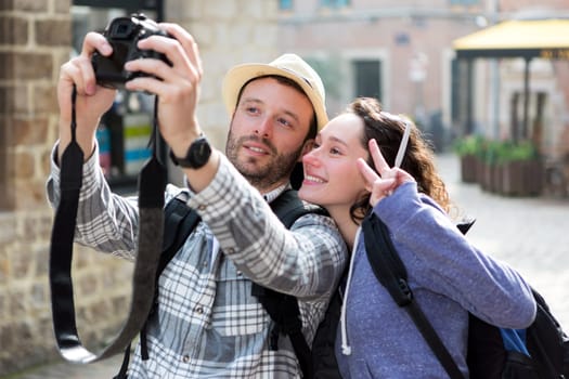 View of a Young couple on holidays taking selfie