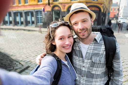 View of a Young couple on holidays taking selfie