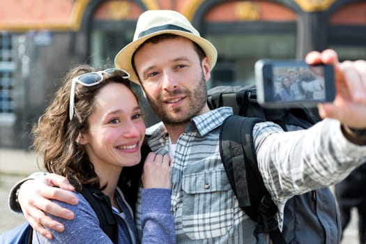 View of a Young couple on holidays taking selfie