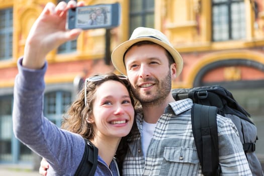 View of a Young couple on holidays taking selfie