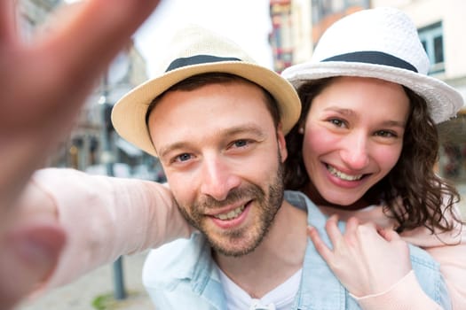 View of a Young couple on holidays taking selfie