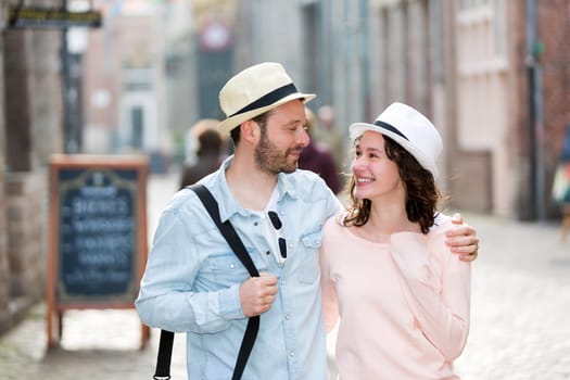 View of a Young couple visiting city during holidays
