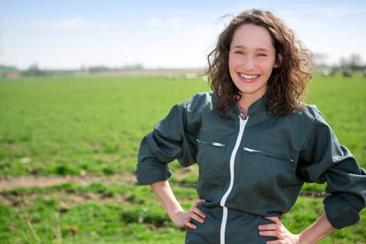 View of a young attractive farmer in fields