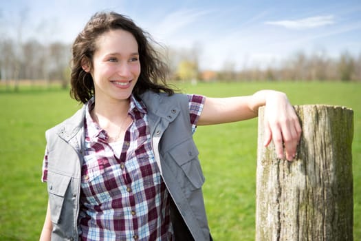 View of a young attractive farmer in fields