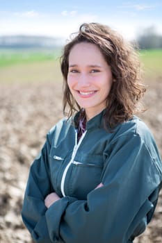 View of a young attractive farmer in fields