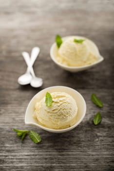 Vanilla Ice cream on a wooden background close up