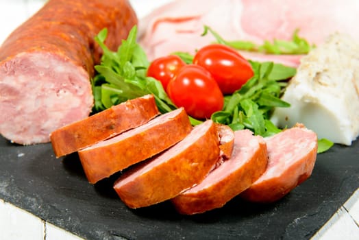 charcuterie plate with bread and tomatoes