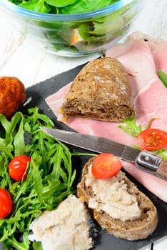 charcuterie plate with bread and tomatoes