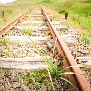 Old Wood Tie iron. Old railroad in the country