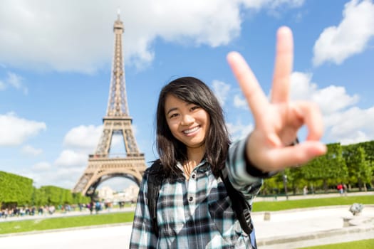 View of Young attractive asian tourist enjoying her Paris trip