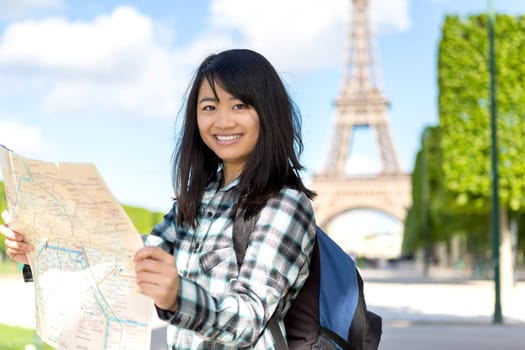 View of a Young attractive asian tourist visiting Paris