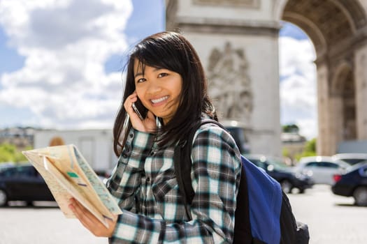 View of a Young attractive asian tourist visiting Paris