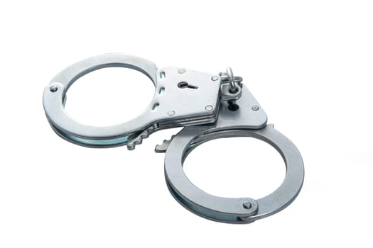 Metal handcuffs on a white isolated background, copy space. High quality photo