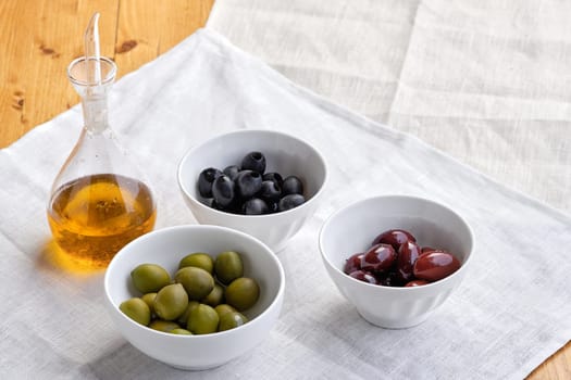 Various kinds of olives and olive oil