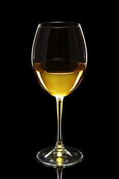 Glass of white wine isolated on black