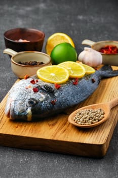 Gilt head bream with spice prepared for cooking (soft focus photo with selective focus)