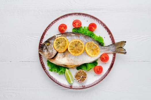Overhead view of gilt head bream baked in oven