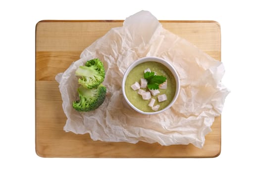 Soup puree with broccoli in cardboard cup, top view