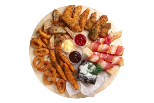 Big set of snack for beer with onion rings and carrot in breading, chicken wings, garlic brown bread and bacon