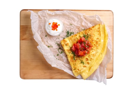 Top view of thin pancakes with salmon and red caviar isolated on white background