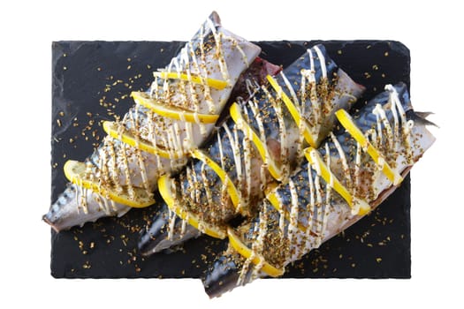 Fresh mackerel with spices and lemon ready for barbecue