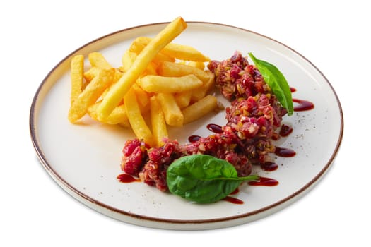 Beef tar tar  with balsamic sauce, basil and french fries isolated on white