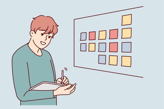 Motivated businessman brainstorm wok with sticky notes on board in office. Male employee or worker involved in creative thinking at workplace. Vector illustration.