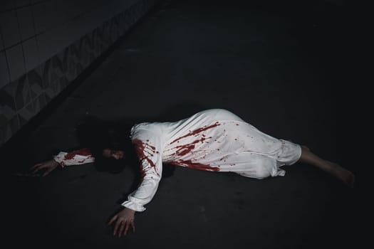 Horror bloodthirsty woman ghost horror she death and scary at dark night in tunnel, The girl was hit by a car and lying died on the road. full of blood left unattended, Happy halloween day festival