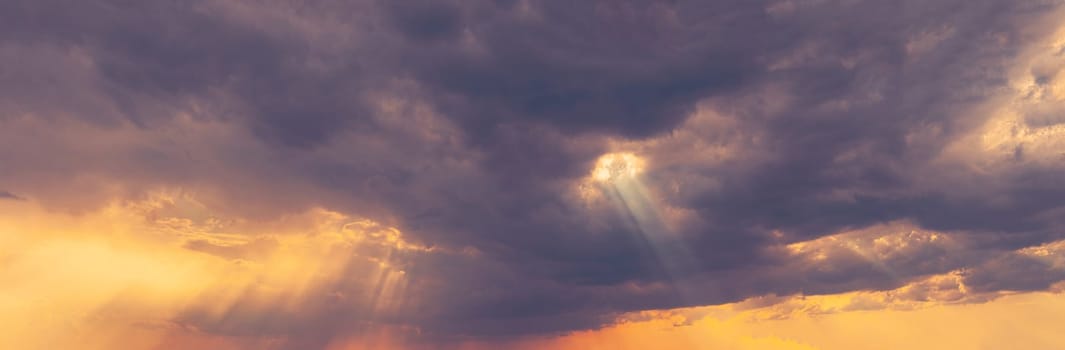 Sunshine In Sunrise Bright Dramatic Sky. Sun Ray Through Dark Rainy Clouds. Scenic Colorful Sky At Dawn. Sunset Sky Natural Abstract Background. Panorama.