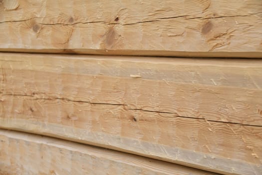 Beveled pine in the raw state as a background. The pine is a softwood. The wood is coated with linseed oil balsam turpentine and thus made more durable.