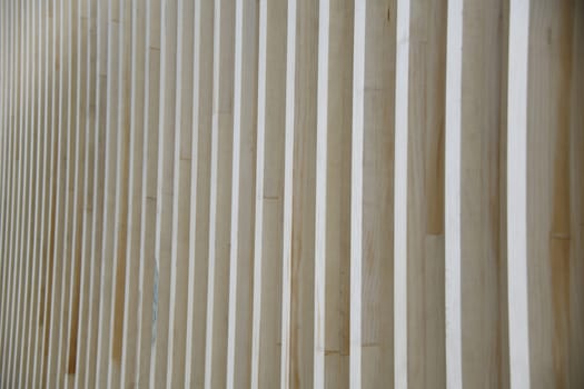 A wooden structure with waves and deformations as a background. Wood is a renewable raw material.