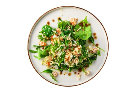 Salad with shrimps, arugula, cucumber, cheese and balsamic sauce isolated on white