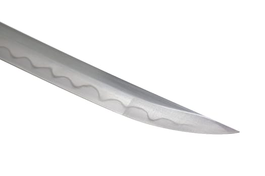 Japanese sword blade on white background. Soft focus. The wavy pattern on the blade edge is a line of hardness that a blacksmith makes so that the blade doesn't break. Each piece is unique.