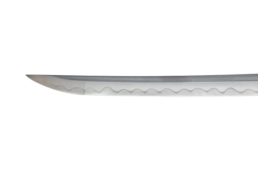 Japanese sword blade on white background. Soft focus. The wavy pattern on the blade edge is a line of hardness that a blacksmith makes so that the blade doesn't break. Each piece is unique.
