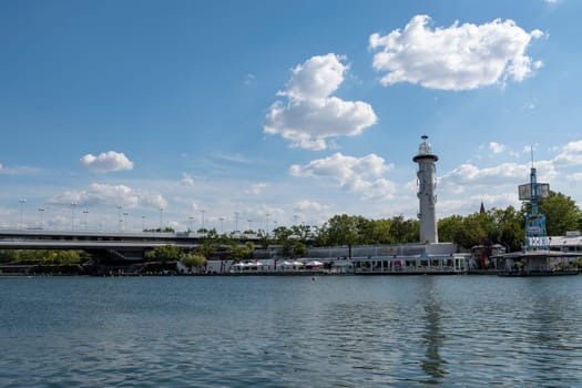 Vienna, Austria - August 10, 2022: The Viennese use them to relax, in bars and restaurants along the Old Danube or at Copa Beach and Sunken City on Danube Island.