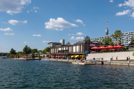 Vienna, Austria - August 10, 2022: The Viennese use them to relax, in bars and restaurants along the Old Danube or at Copa Beach and Sunken City on Danube Island.
