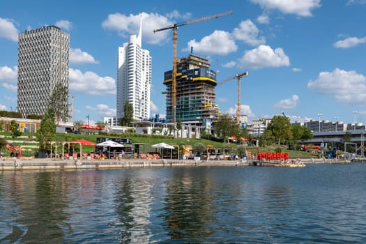Vienna, Austria - August 10, 2022: The Viennese use them to relax, in bars and restaurants along the Old Danube or at Copa Beach and Sunken City on Danube Island.