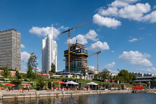 Vienna, Austria - August 10, 2022: The Viennese use them to relax, in bars and restaurants along the Old Danube or at Copa Beach and Sunken City on Danube Island.