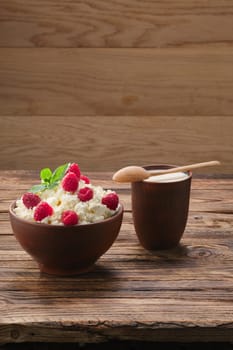 Dairy products: milk, cottage cheese, raspberry and mint. Copy space background