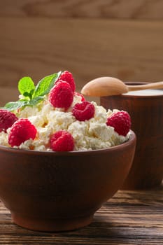Dairy products: milk, cottage cheese, raspberry and mint. Copy space background