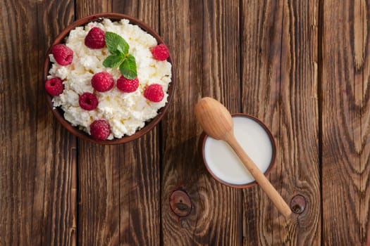 Dairy products: milk, cottage cheese, raspberry and mint. Copy space background