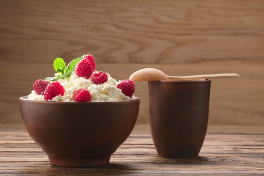 Dairy products: milk, cottage cheese, raspberry and mint. Copy space background